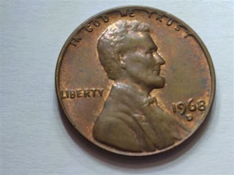kf ls ja ke. . 1968 penny in god we trust touching rim